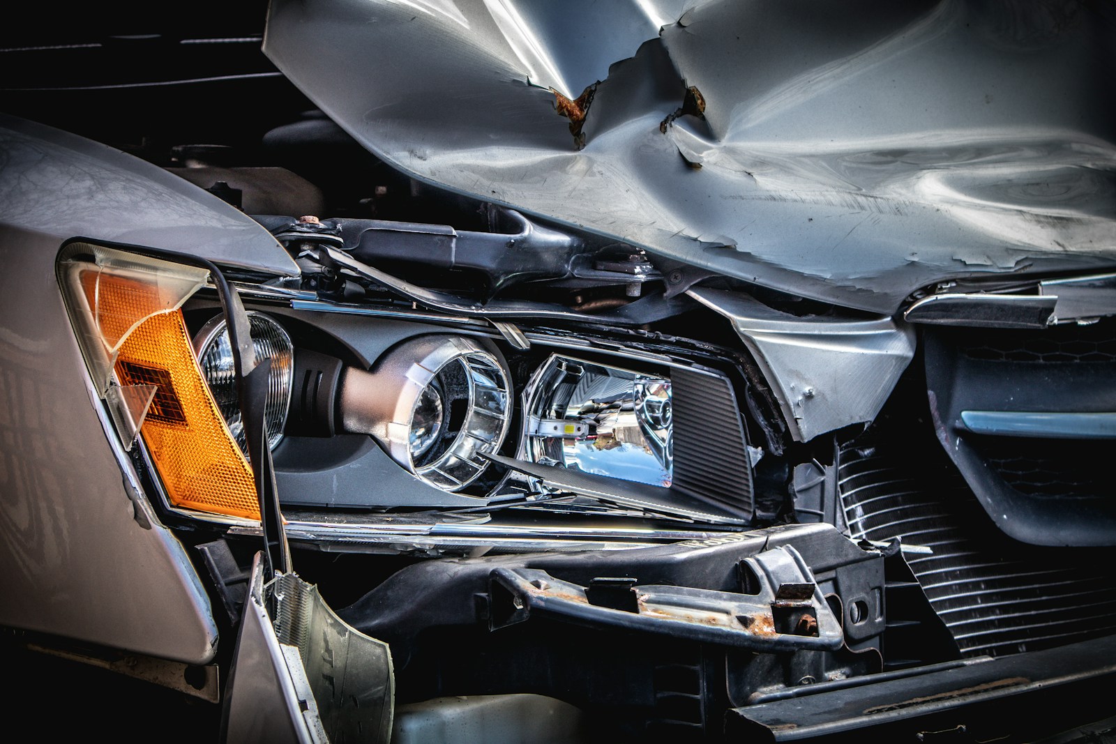 silver and black car engine in accident